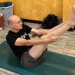 Older man doing yoga
